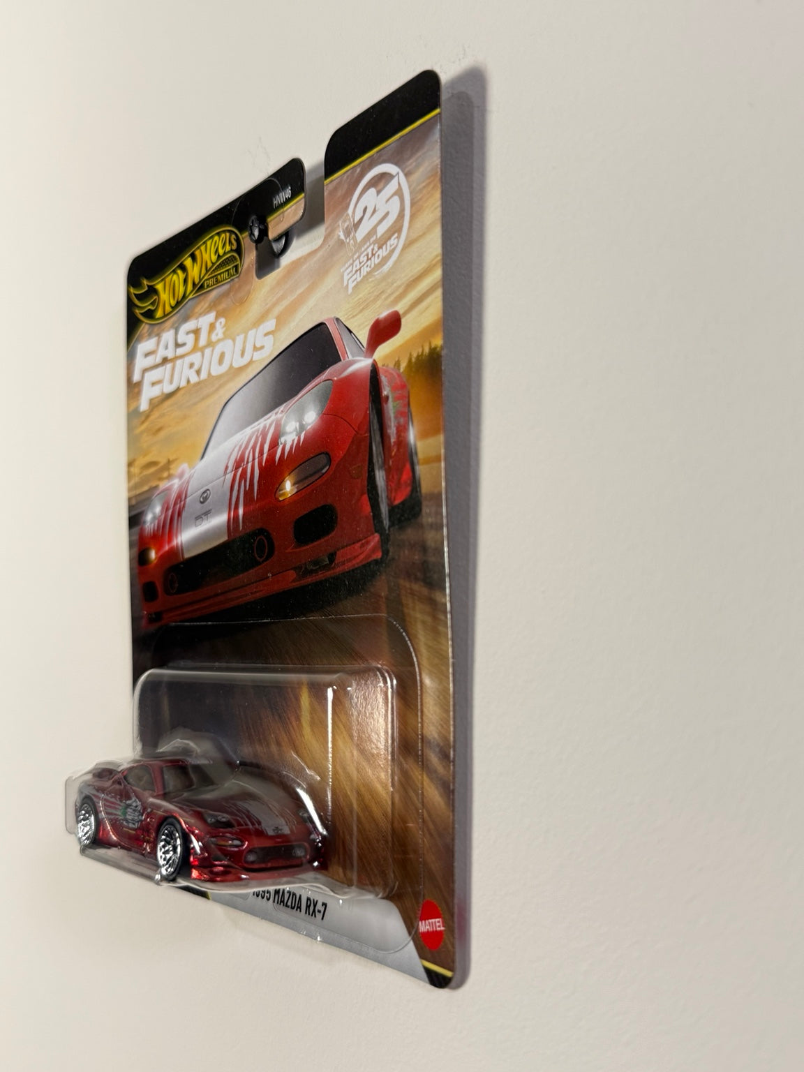 1995 Mazda RX-7 Hot Wheels Premium Fast & Furious 25th Anniversary, front quarter packaging view