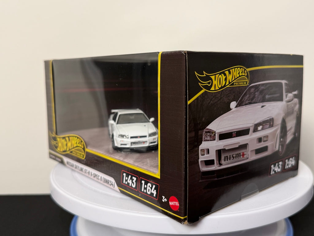 White Nissan Skyline GT-R V-Spec II BNR34 Hot Wheels Premium 1:43 and 1:64 boxed set, angled view